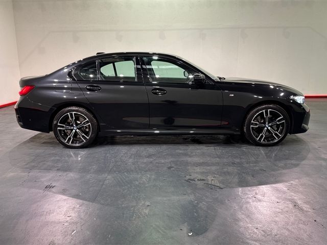 Image for 2025 BMW 3 Series 330E BLACK SAPPHIRE M SPORT SALOON – 18’’ FACTORY ALLOYS – M PERFOMANCE TEX – CRUISE CONTROL - HEATED SEATS – DIGITAL DISPLAY – FLAT BOTTOM M SPORT STEERING WHEEL – REAR CAMERA/PARKING