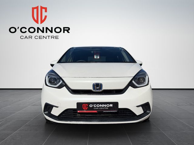 Image for 2020 Honda Fit "Pure white, pure efficiency — the hybrid that smiles back at you every time you start it"