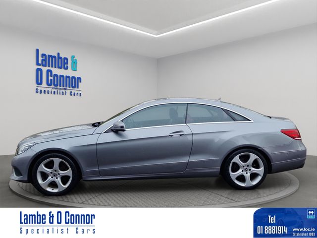 Image for 2015 Mercedes-Benz E Class E 220 AUTO COUPE * PALLADIUM SILVER METALIC / RED LEATHER * ACTIVE PARK ASSIST * HEATED SEATS * LOW MILEAGE WITH A DOCUMENTED SERVICE RECORD * BEST AVAILABLE * 