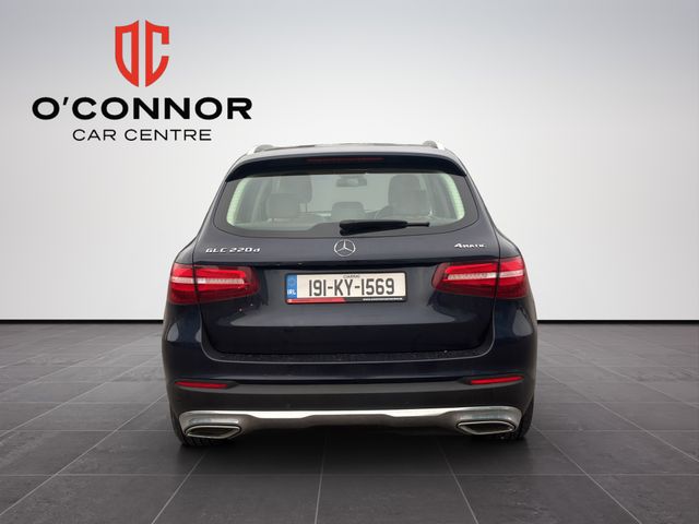 Image for 2019 Mercedes-Benz GLC Class Navy suit, cream interior — dressed better than most weddings.