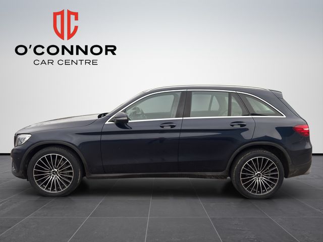 Image for 2019 Mercedes-Benz GLC Class Navy suit, cream interior — dressed better than most weddings.