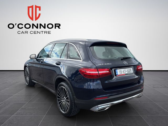 Image for 2019 Mercedes-Benz GLC Class Navy suit, cream interior — dressed better than most weddings.