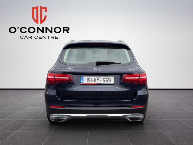 Image for 2019 Mercedes-Benz GLC Class Navy suit, cream interior — dressed better than most weddings.