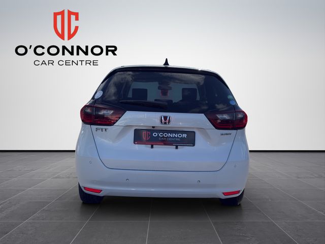 Image for 2020 Honda Fit "Pure white, pure efficiency — the hybrid that smiles back at you every time you start it"