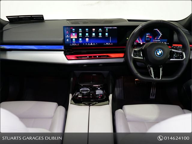 Image for 2025 BMW 5 Series *PANORAMIC SUNROOF, TECH PACK AND 20” 939 ALLOYS* SOPHISTO GREY METALLIC WITH IVORY VEGANZA INTERIOR. 530e TOURING M-SPORT