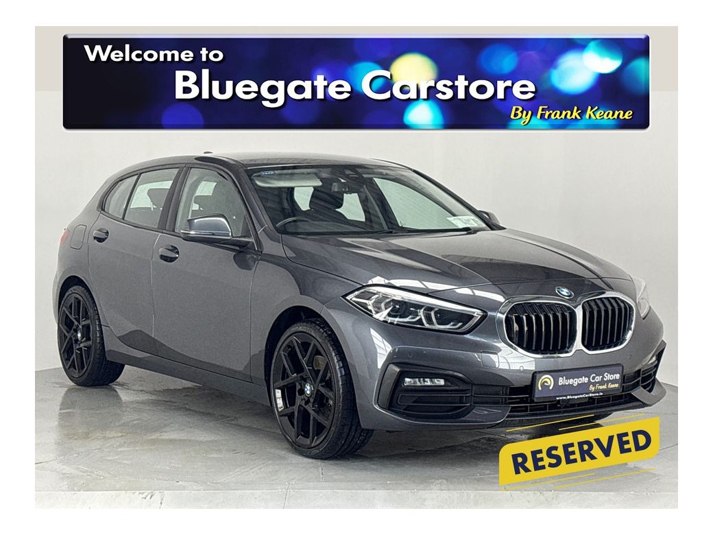 Image for 2020 BMW 1 Series 118i *New 19" Alloys*Surround Parking Sensors*Multimedia Touchscreen Infotainment System*Sat-Nav*Cruise Control*Automatic Headlights*Drive Select Modes*NEW: 19” Gloss Black Alloy Wheels*
