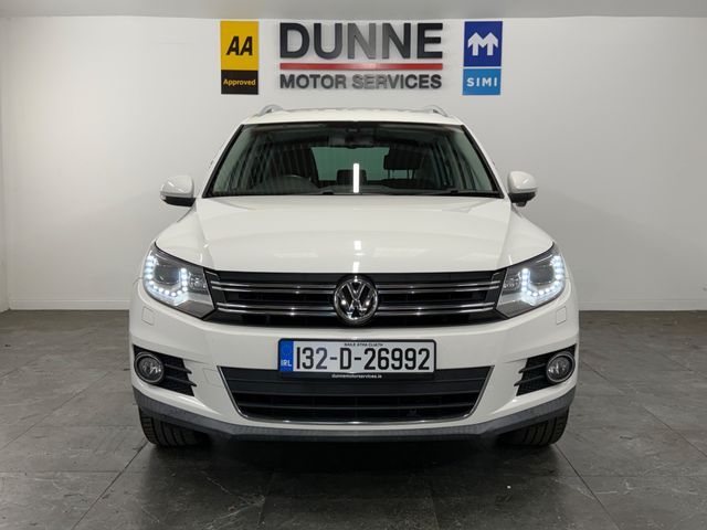 Image for 2013 Volkswagen Tiguan **TOUCHSCREEN BLUETOOTH RADIO **REVERSING CAMERA **REVERSING SENSORS **AUTO START STOP **ELECTRIC HANDBRAKE **AUTO HOLD **AUTO HEADLIGHTS **DUAL CLIMATE CONTROL **FACTORY WIND DEFLECTORS **POWER FOLD