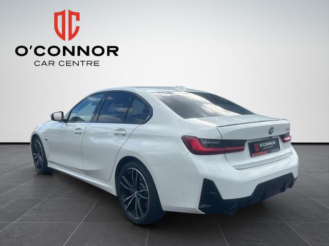Image for 2024 BMW 3 Series White outside, Tacora Red inside — subtle was never the plan.