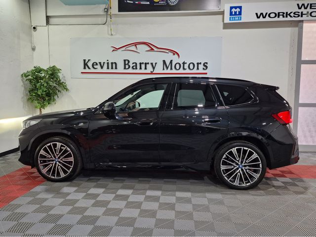 Image for 2023 BMW iX1 30 M SPORT (PRO PACK) X-DRIVE AUTOMATIC **ONE OWNER / 20" IND ALLOYS / ADAPTIVE LED HEADLIGHTS / COMFORT ACCESS / HARMAN KARDON SOUND / REVERSE CAMERA / WIRELESS PHONE CHARGING / BMW SERVICE PACK**