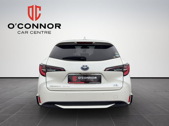 Image for 2020 Toyota Corolla "Pearl white with plenty of life — the hybrid that keeps giving, mile after mile"