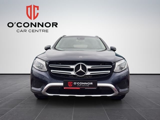 Image for 2019 Mercedes-Benz GLC Class Navy suit, cream interior — dressed better than most weddings.