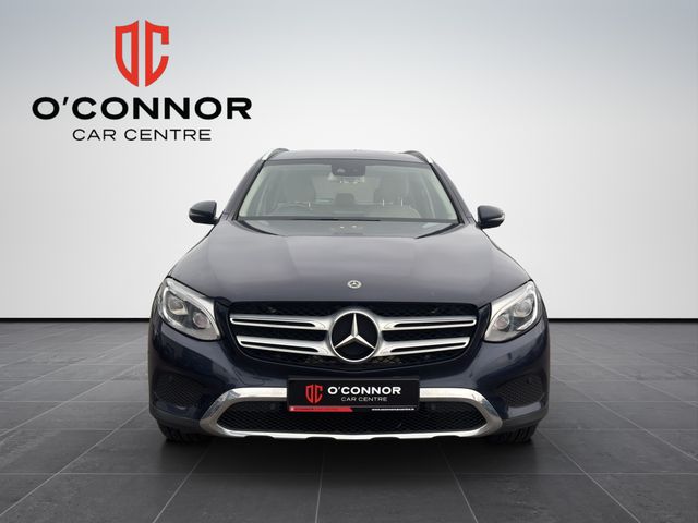 Image for 2019 Mercedes-Benz GLC Class Navy suit, cream interior — dressed better than most weddings.