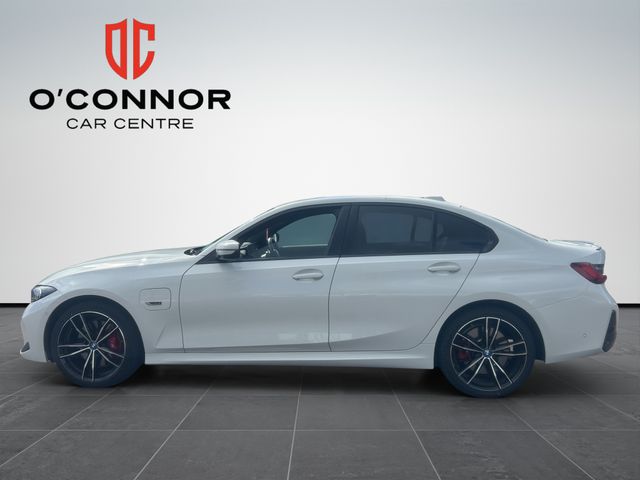 Image for 2024 BMW 3 Series White outside, Tacora Red inside — subtle was never the plan.