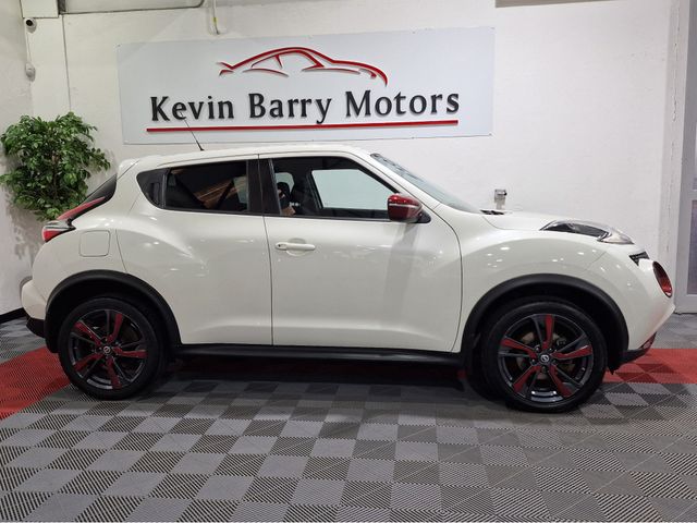 Image for 2015 Nissan Juke 1.2 SV (RED EXT & INT PACK) 6 SPEED MANUAL **ORIGINAL IRISH CAR / VERY LOW MILEAGE / 18" ALLOYS / BLUETOOTH / CRUISE CONTROL / KMH SPEEDOMETER / TWO TONE CLOTH INTERIOR / FULL SERVICE RECORD**