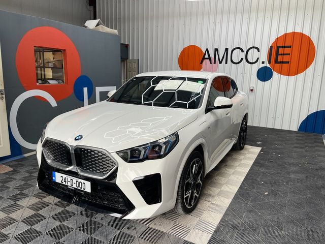 Image for 2024 BMW iX2 2024 BMW IX2 XDRIVE30 AUTOMATIC / CRUISE CONTROL / PARKING CAMERA / ELECTRIC MEMORY & HEATED SEATS / PANORAMIC SUNROOF / PADDLE SHIFTERS / AMBIENT LIGHTS AND MORE