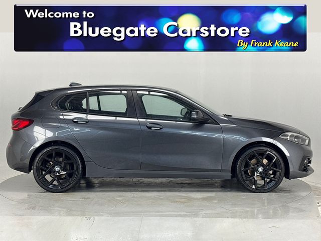 Image for 2020 BMW 1 Series 118i *New 19" Alloys*Surround Parking Sensors*Multimedia Touchscreen Infotainment System*Sat-Nav*Cruise Control*Automatic Headlights*Drive Select Modes*NEW: 19” Gloss Black Alloy Wheels*