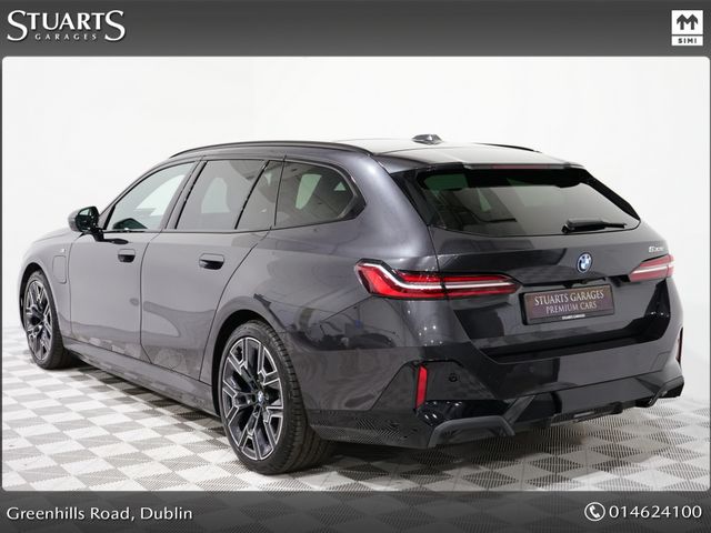 Image for 2025 BMW 5 Series *PANORAMIC SUNROOF, TECH PACK AND 20” 939 ALLOYS* SOPHISTO GREY METALLIC WITH IVORY VEGANZA INTERIOR. 530e TOURING M-SPORT