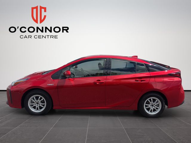 Image for 2019 Toyota Prius Red Prius energy — passing petrol stations like they offended you