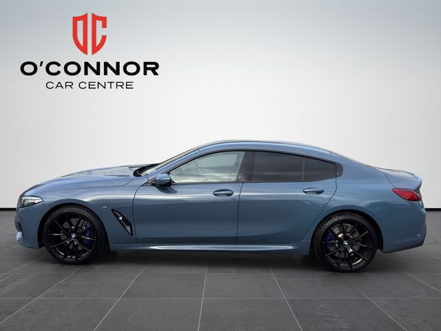 Image for 2021 BMW 8 Series Barcelona Blue, cream leather, big spec — this 840i is pure class.