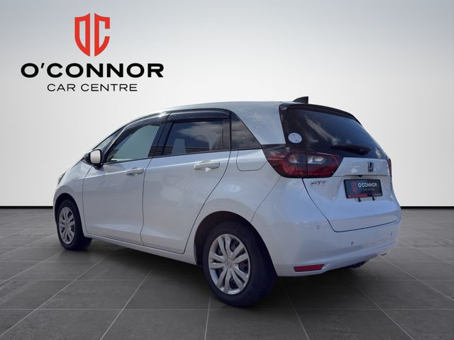 Image for 2020 Honda Fit "Pure white, pure efficiency — the hybrid that smiles back at you every time you start it"