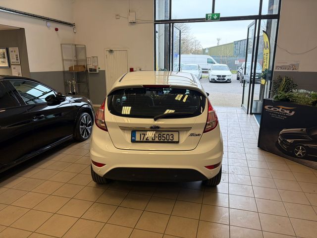 Image for 2017 Ford Fiesta MCA Titanium 1.25 60PS M5 4DR Irish Owned Car With NCT & Tax, Parking Sensor, CD Player, 2 Keys, Air Conditioning, Irish Radio, Service History, Folding Rear Seats, Alloy Wheels, and more.