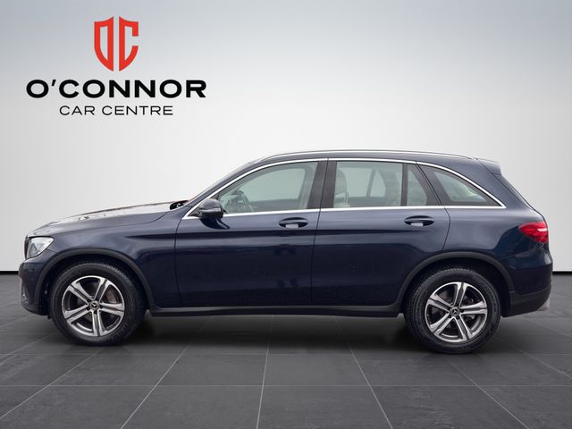 Image for 2019 Mercedes-Benz GLC Class Navy suit, cream interior — dressed better than most weddings.