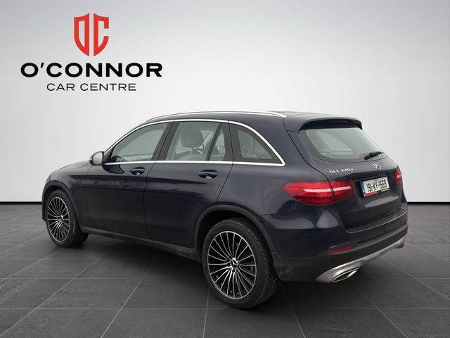 Image for 2019 Mercedes-Benz GLC Class Navy suit, cream interior — dressed better than most weddings.