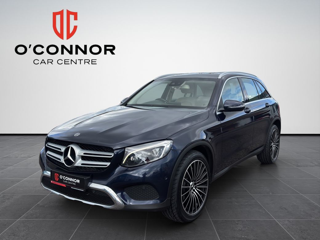 Image for 2019 Mercedes-Benz GLC Class Navy suit, cream interior — dressed better than most weddings.