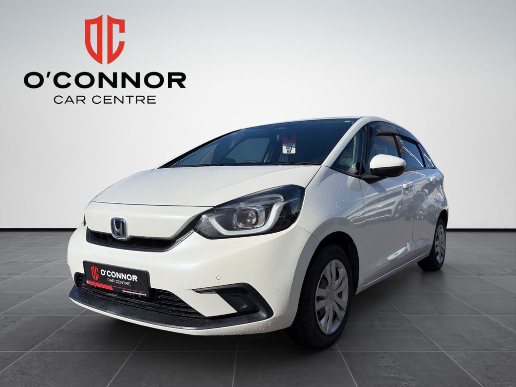 Image for 2020 Honda Fit "Pure white, pure efficiency — the hybrid that smiles back at you every time you start it"