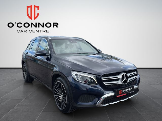 Image for 2019 Mercedes-Benz GLC Class Navy suit, cream interior — dressed better than most weddings.