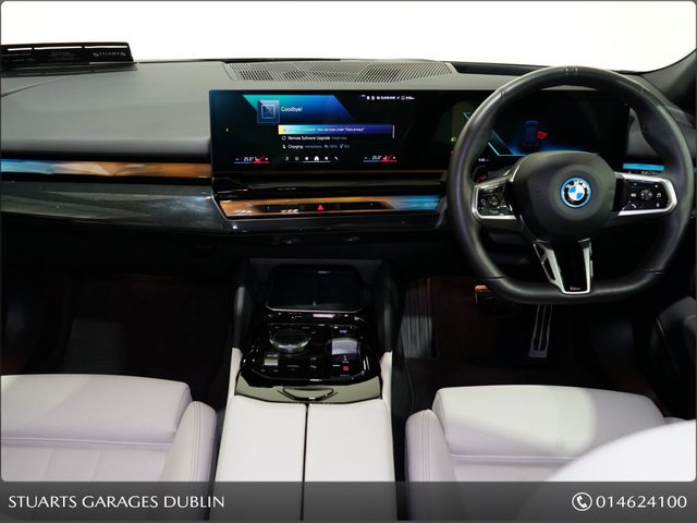 Image for 2025 BMW i5 **TECH PACK, 20” ALLOYS** , 570KM CLAIMED RANGE, CARBON BLACK METALLIC, IVORY VEGANZA INTERIOR WITH DARK ASH WOOD