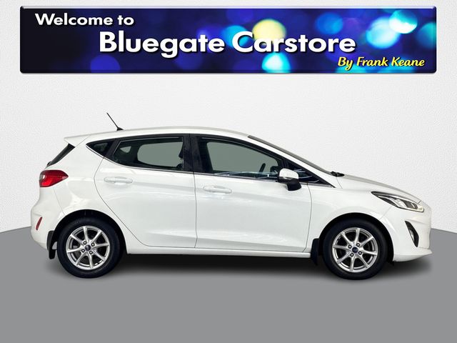 Image for 2018 Ford Fiesta TITANIUM 1.1 85PS 5M **FULL BLACK CLOTH INTERIOR**BLUETOOTH AUDIO**TOUCHSCREEN INFOTAINMENT SCREEN**SEMI DIGITAL DASH**MANUAL HANDBRAKE**LANE KEEPING ASSIST**A/C**SPEED LIMITER**USB CHARGING PORT**
